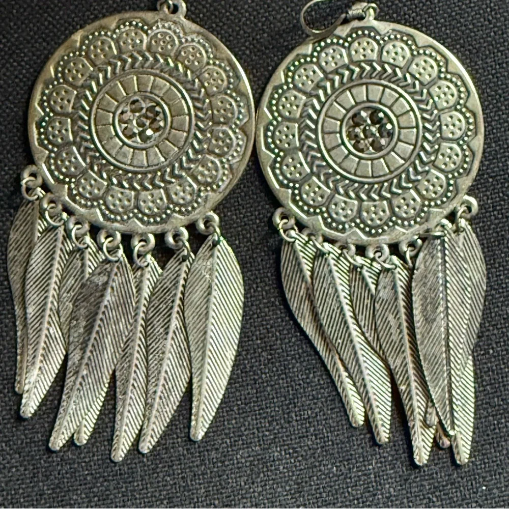 Medallion and Feather Dangle Earrings in Silver Tone